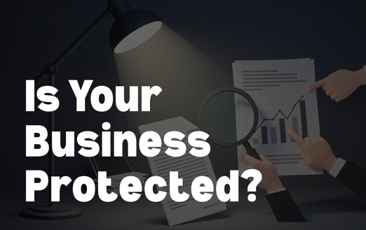 Small business owner reviewing continuity documents and financial plans.